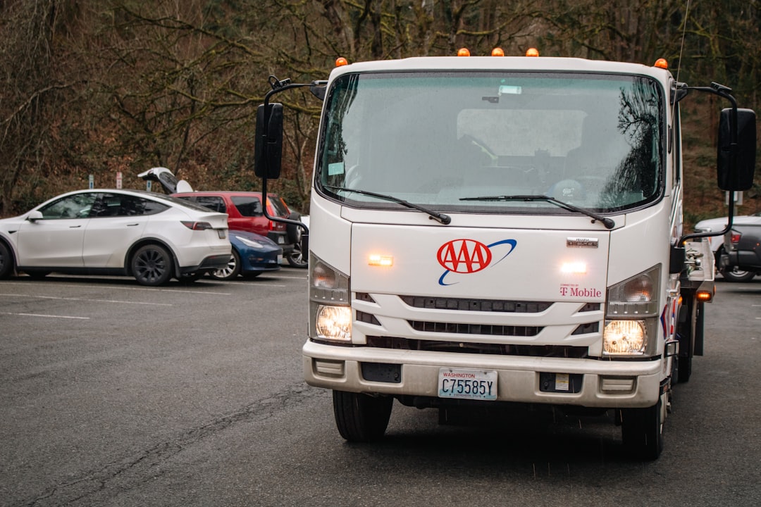 A white AAA tow truck.