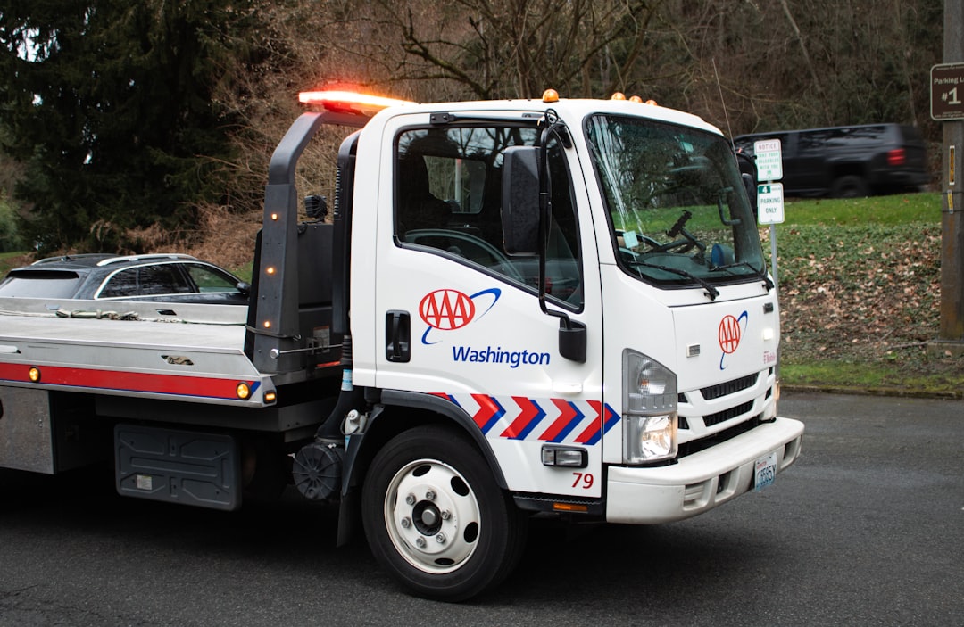 A white AAA tow truck.